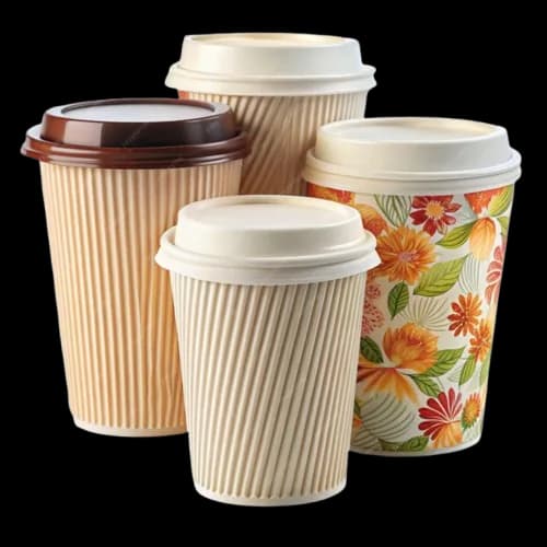 Rows of paper coffee cups on a café counter